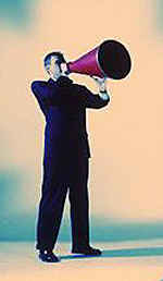 man shouting through a megaphone