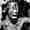portin of photo of man telling story to the tribe, click here to go to essay
