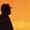 portion of photo of man on beach at sunset, click here to go to essay