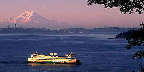 ferry arriving at vashon island with mt. rainier in the background