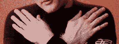 man with arms folded over his chest