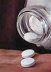 aspirin coming out of a bottle