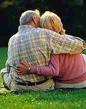 couple embracing on grass