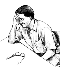 tired man sitting at table